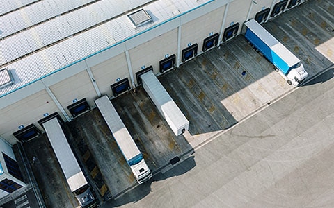 Semi-trucks parked at transportation hub