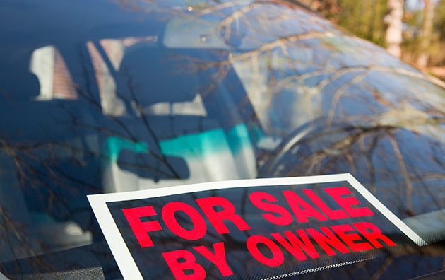 For sale by owner sign on used car