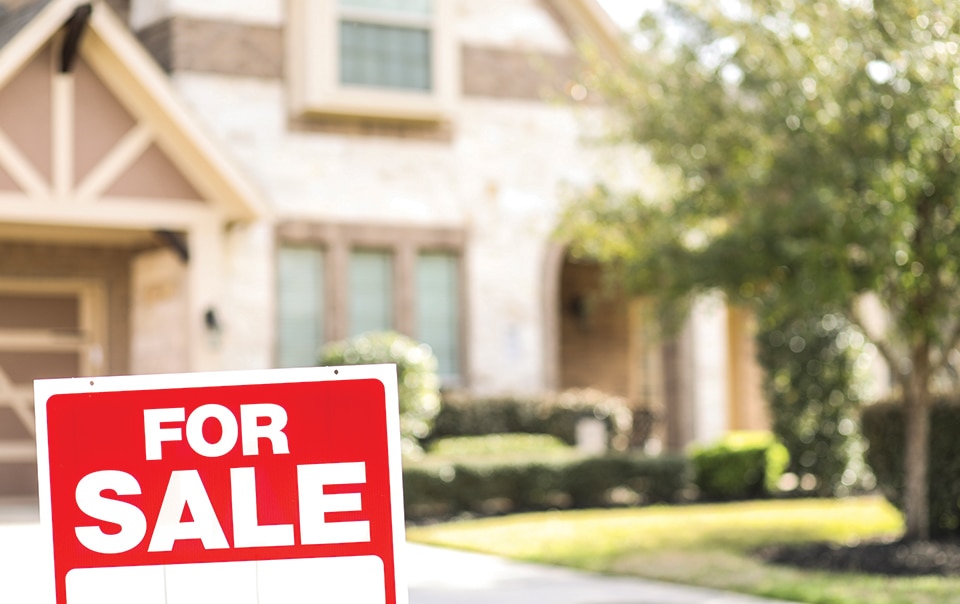 house with for sale sign in front, pros and cons of selling a house now