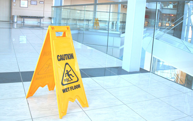 slips sign on floor of workplace