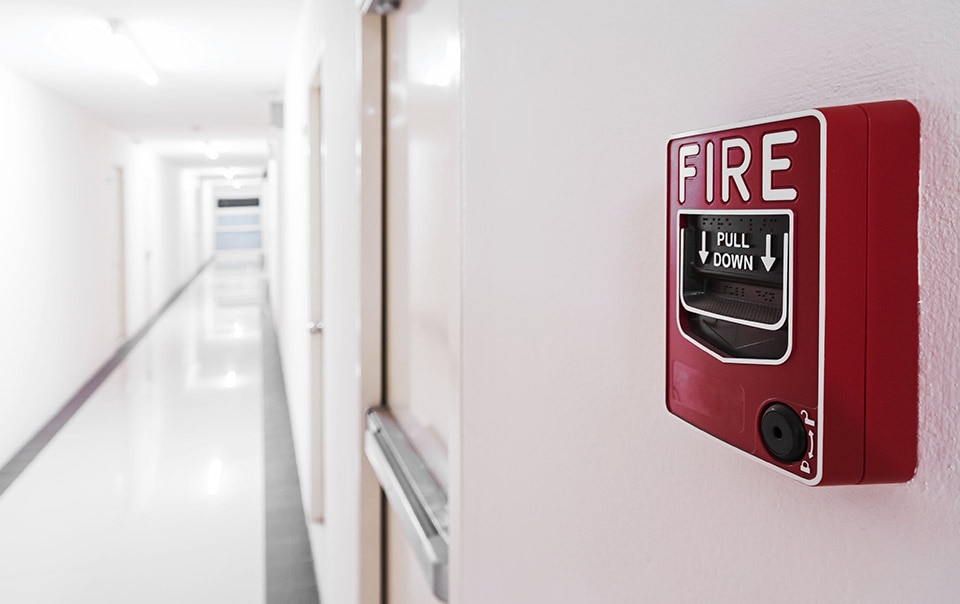 Fire alarm in a hallway as part of fire safety plan