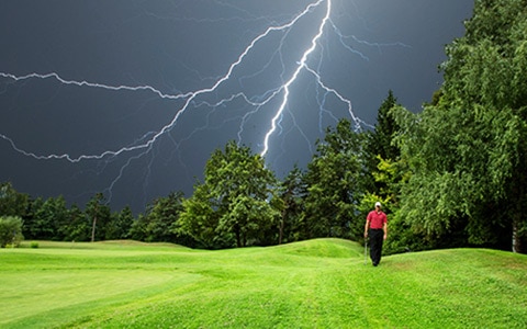 Lightning strike as someone plays golf