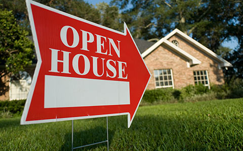 Open house sign in front of house