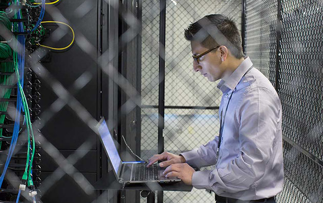 Person using computer in server room to protect against Shadow IT