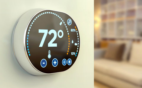 Smart thermostat on a wall