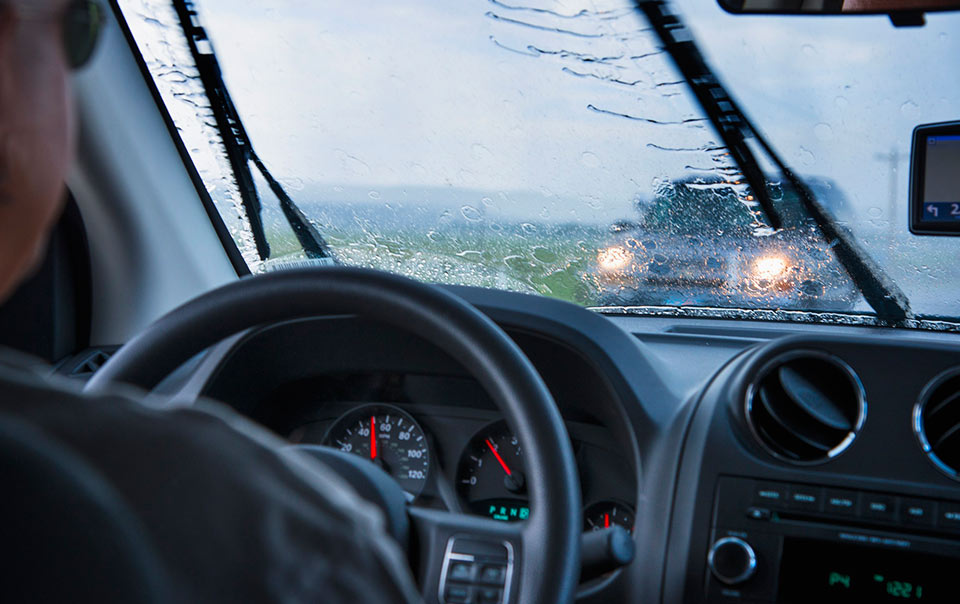 Man driving in a spring storm