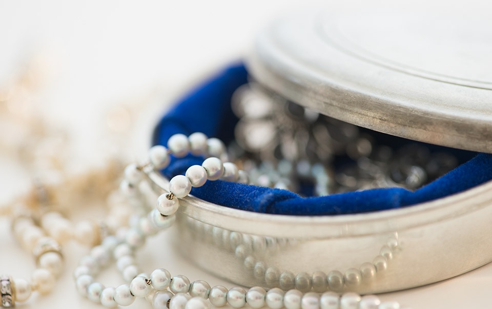 Pearls in a jewelry box covered in valuable items insurance coverage