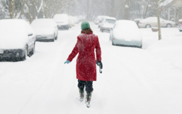 woman walking in snow storm